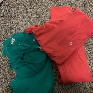 Two lululemon athletica Coral and Teal Top & leggings sets
